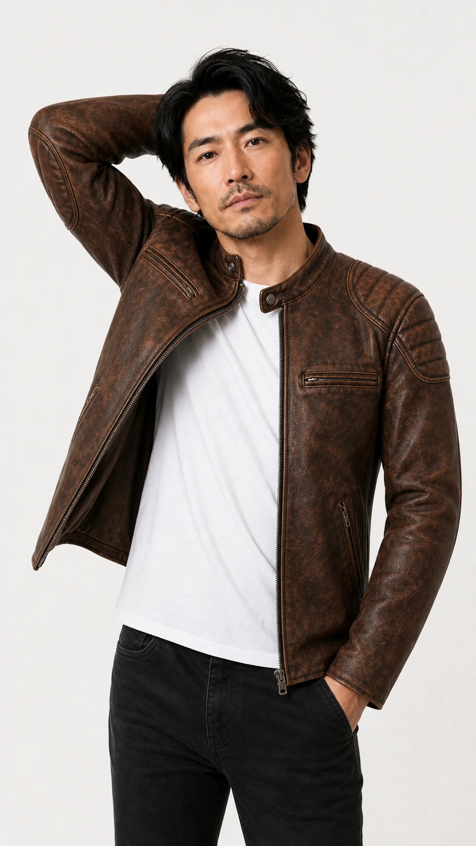 Man raising his arm in the distressed brown leather biker jacket