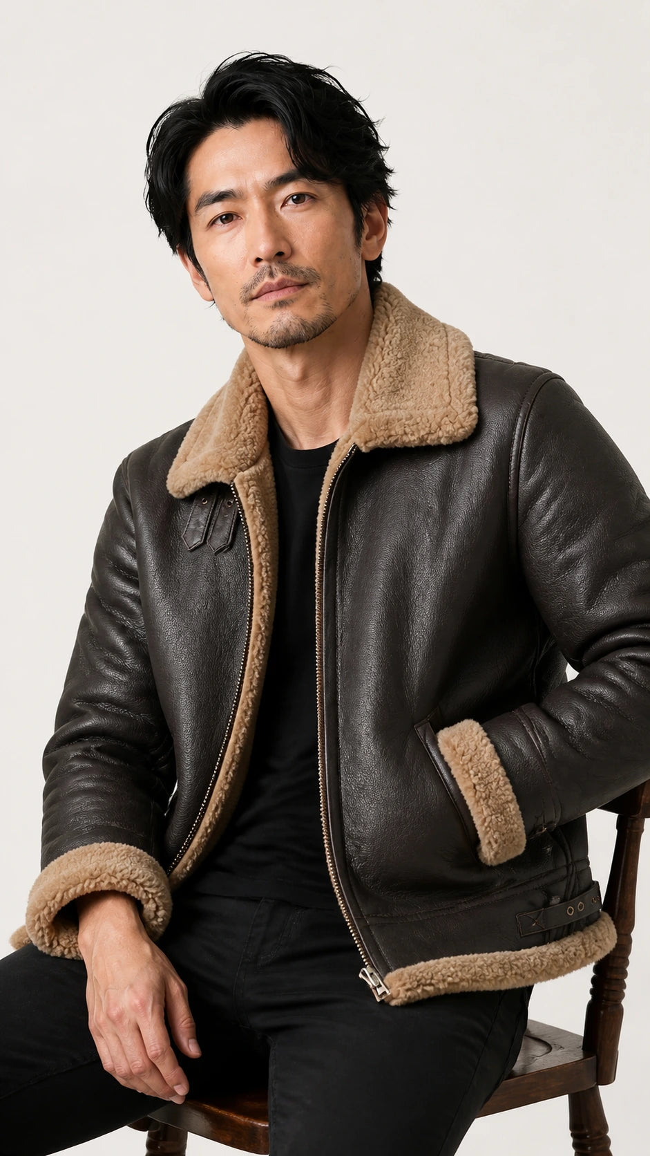 Man seated wearing the brown B-3 shearling flight jacket