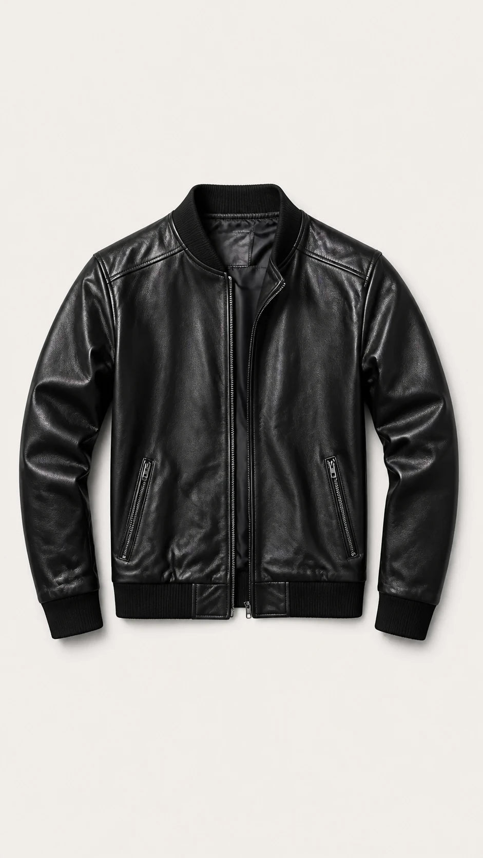 Black sheepskin bomber jacket laid flat, front view
