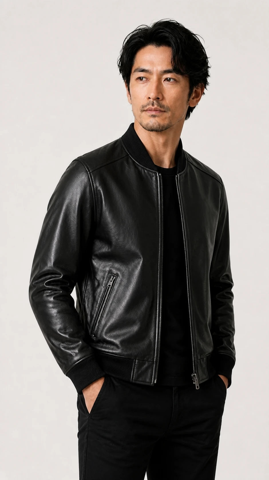 Side view of a man in the black sheepskin bomber jacket