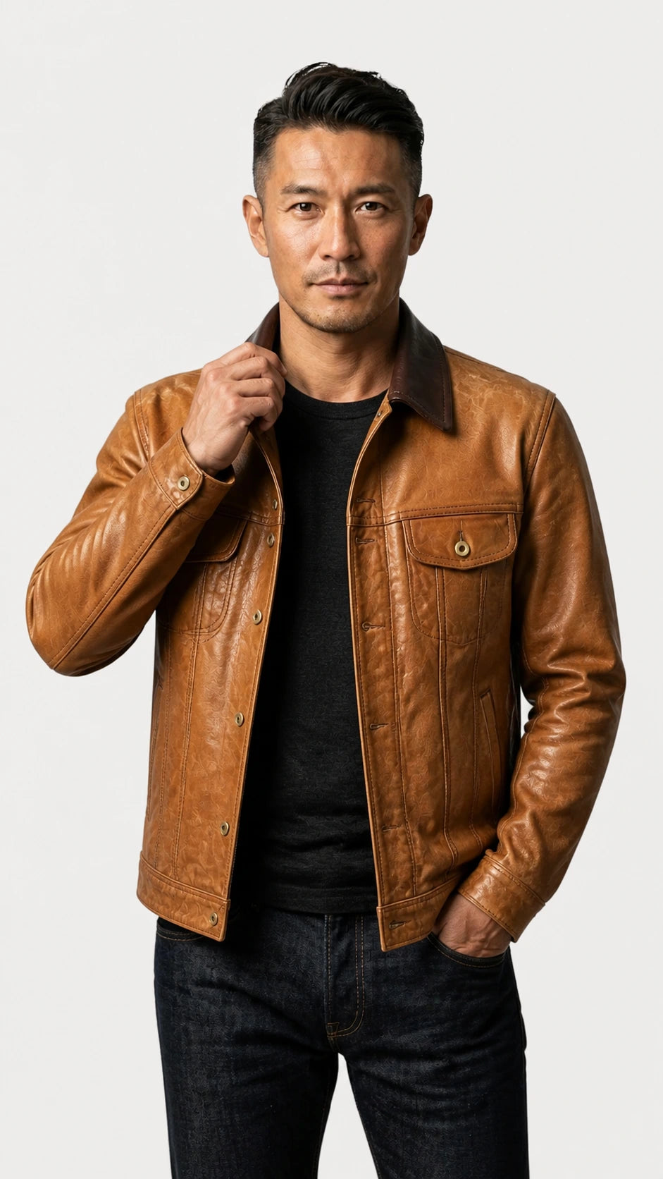 Man wearing the tan goatskin trucker jacket over a dark knit