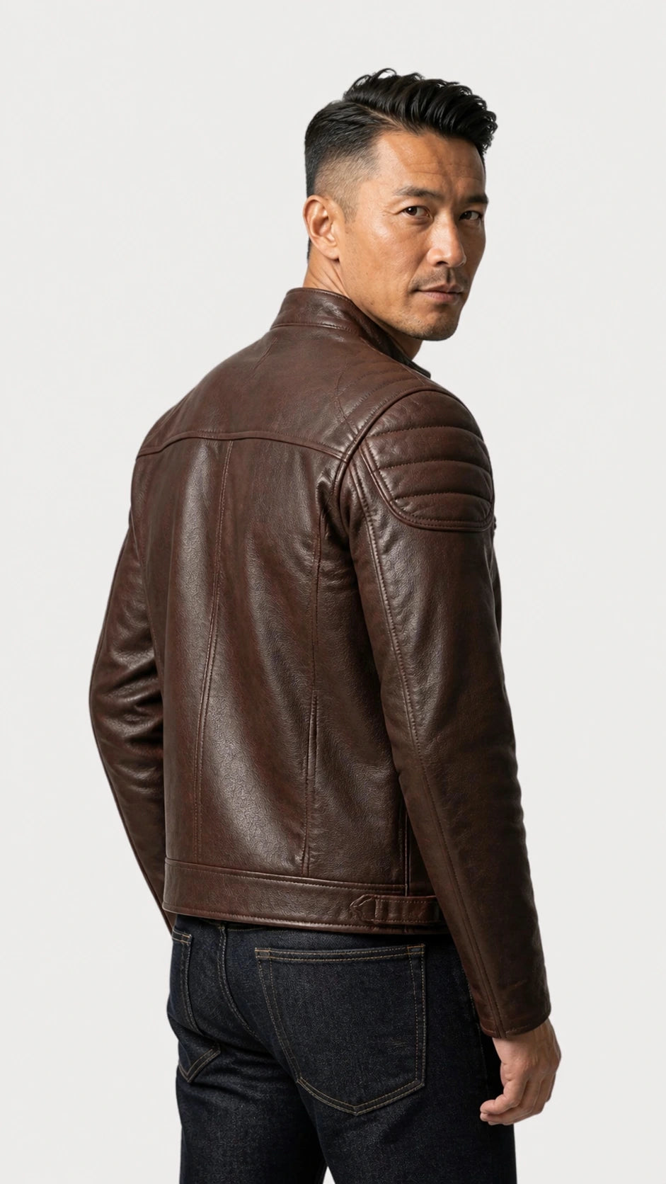 Side view of the vintage brown leather biker jacket on the model
